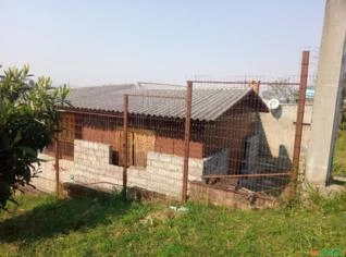 Troco Terreno com Duas Casas por Chácara no RS