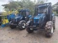 Trator New Holland TL 85E Cabinado com Ar-Condicionado Imagem Trator New Holland TL 85E Cabinado com Ar-Condicionado