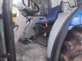 Trator New Holland TL 85E Cabinado com Ar-Condicionado Imagem Trator New Holland TL 85E Cabinado com Ar-Condicionado