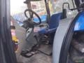 Trator New Holland TL 85E Cabinado com Ar-Condicionado Imagem Trator New Holland TL 85E Cabinado com Ar-Condicionado