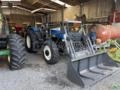 Trator New Holland TL75E 4x4 Ano 2005 com conjunto de concha dianteiro novo Imagem Trator New Holland TL75E 4x4 Ano 2005 com conjunto de concha dianteiro novo