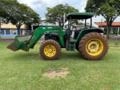 Trator John Deere 6300 4x4 2001 com lâmina e concha Stara Imagem Trator John Deere 6300 4x4 2001 com lâmina e concha Stara